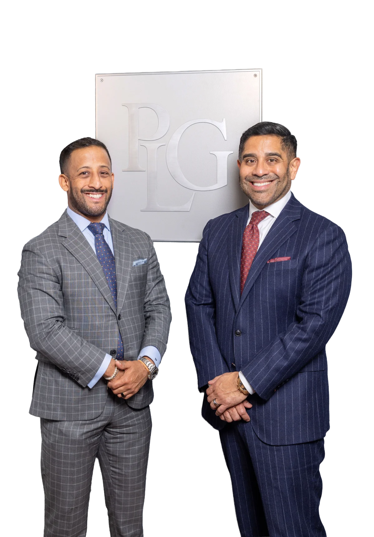Xavier and Steven Palacios — Managing Partner and Partner at Palacios Law Group, standing in front of the PLG logo